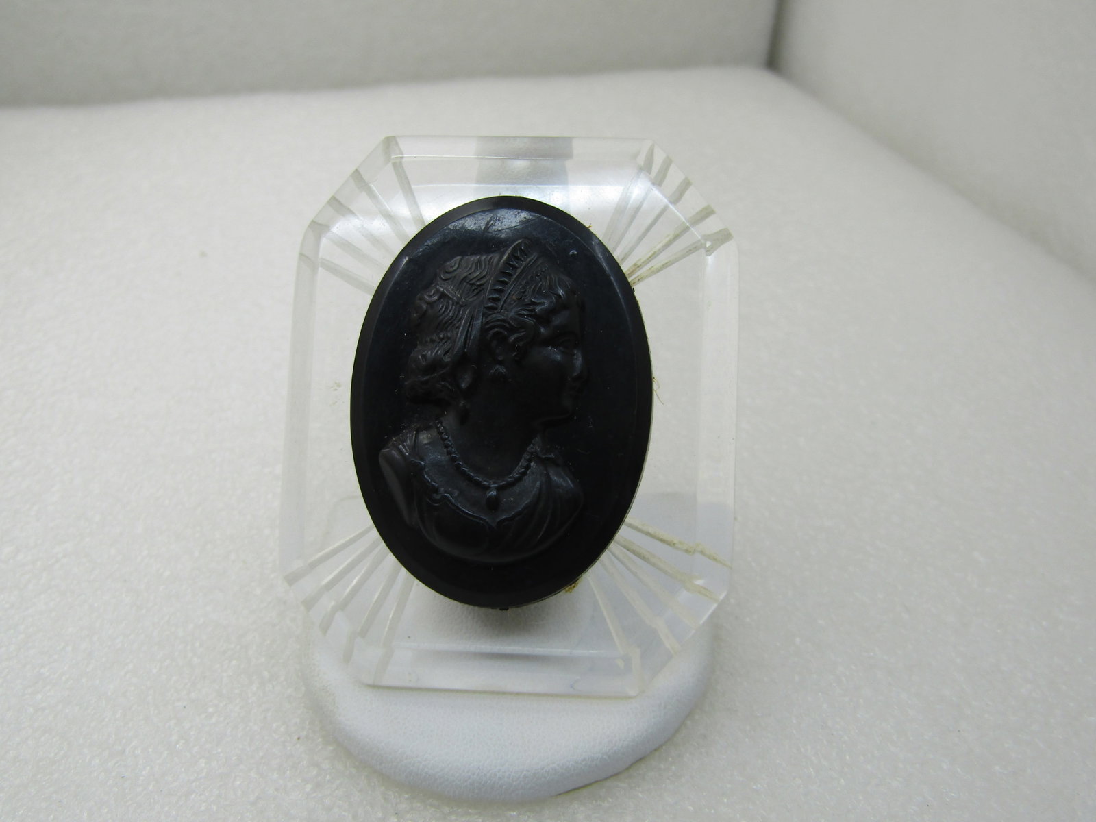 Vintage 1940's Clear Lucite & Black Cameo Brooch, Reverse Carved Frame, 2.5": Title: Vintage 1940's Clear Lucite & Black Cameo Brooch, Reverse Carved Frame, 2.5" Description: Vintage 1940's Clear Lucite & Black Cameo Brooch, Reverse Carved Frame, 2.5" by 2". Beveled edge with f