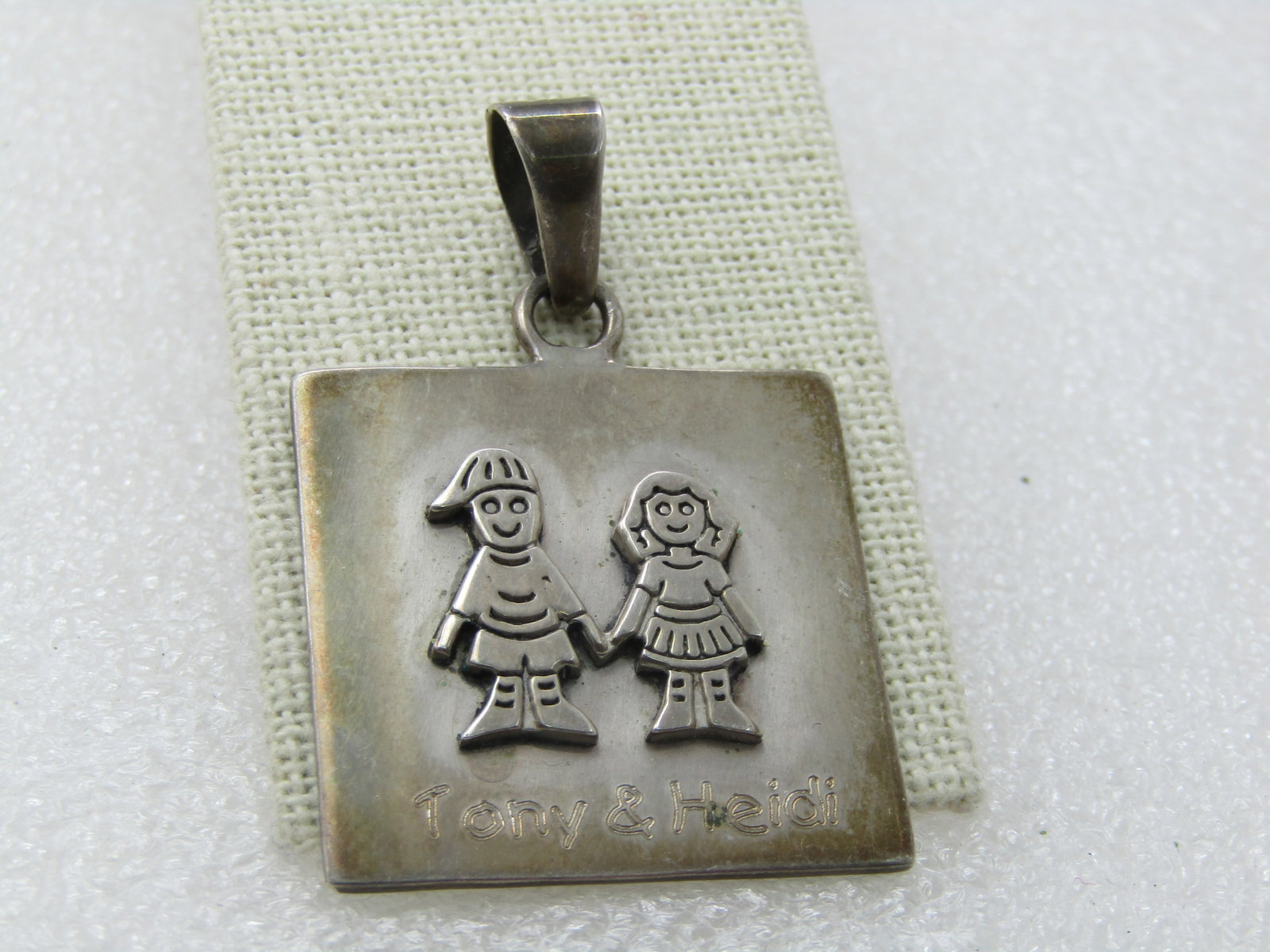 Vintage Sterling Silver Tony & Heidi Couple Pendant, 2", 15.13gr.: Title: Vintage Sterling Silver Tony & Heidi Couple Pendant, 2", 15.13gr. Description: Vintage Sterling Silver Tony & Heidi Couple Pendant, 2", 15.13gr. Engraved Tony & Heidi names under a raised Boy a