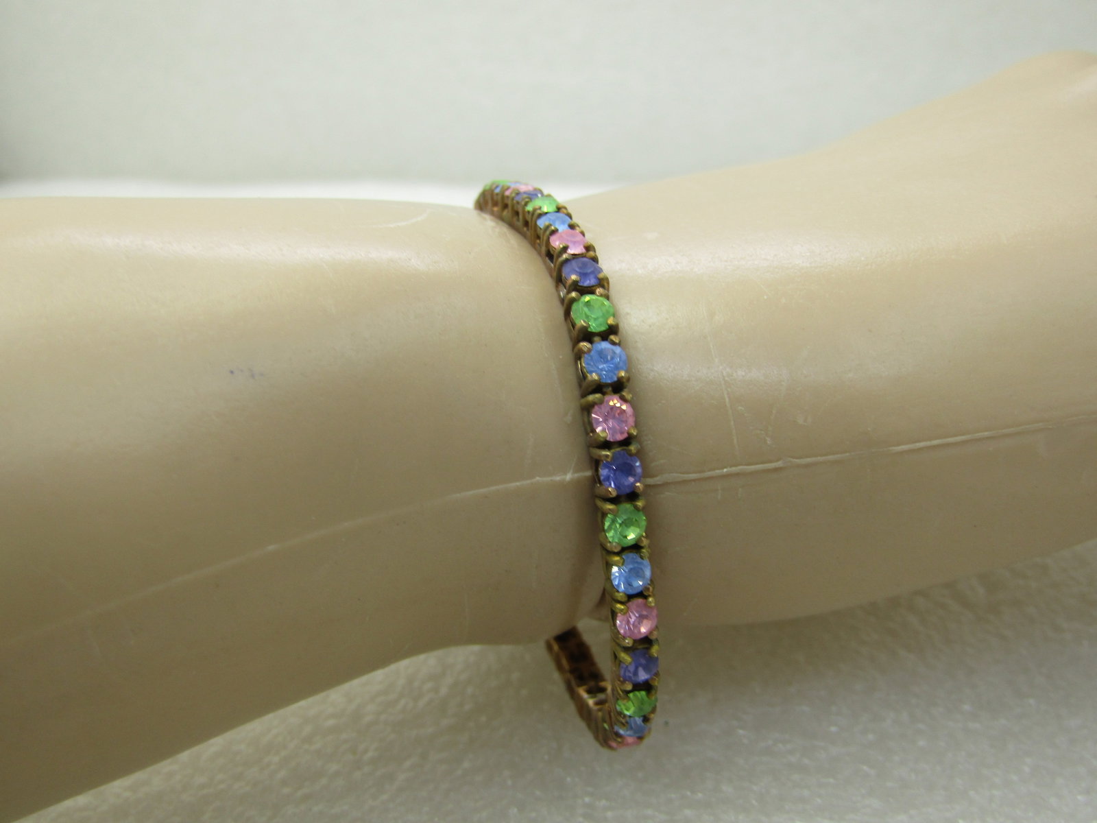 Vintage Joan Rivers Pastel Crystal Tennis Bracelet, 7.75", 3.5mm: Title: Vintage Joan Rivers Pastel Crystal Tennis Bracelet, 7.75", 3.5mm Description: Vintage Joan Rivers Pastel Crystal Tennis Bracelet, 3.75", 3.5mmm Yellow/Rose gold tone with box clasp and slide lo