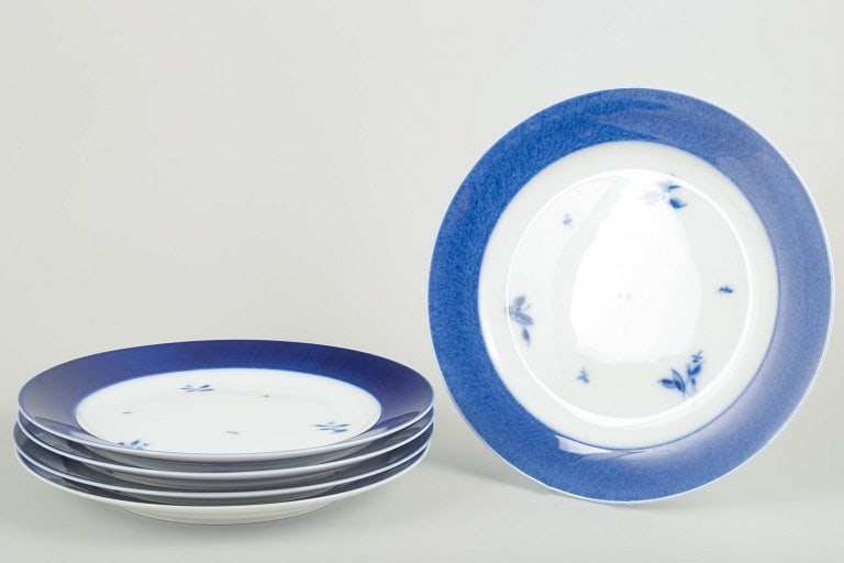 Royal Copenhagen, Denmark. Five large porcelain dinner plates with blue rim and floral accents. (1 of 4)