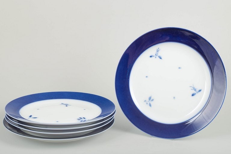 Royal Copenhagen, Denmark. Five large porcelain dinner plates with blue rim and floral accents. (1 of 4)