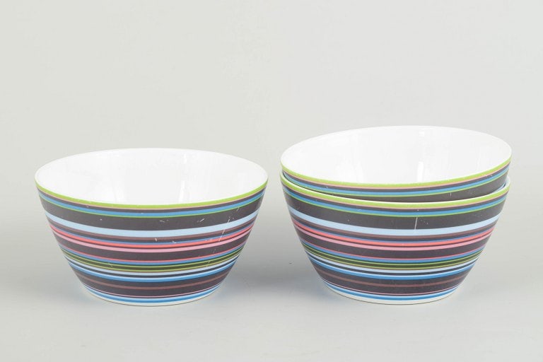 Alfredo Häberli for Iittala, Finland. Three colourful porcelain bowls with multicoloured horizontal: Alfredo Häberli for Iittala Bowls “Origo”, 2000s. Three colourful porcelain bowls from the iconic Origo series, decorated with the characteristic multicoloured horizontal stripes. Some surfac