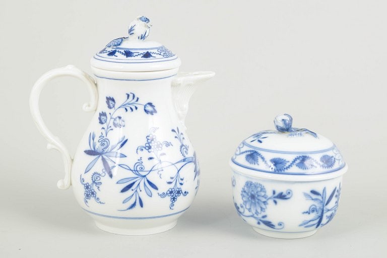 Meissen, Germany. Porcelain sugar bowl and demi-tasse pot decorated with cobalt blue glaze, “Blue: Meissen Sugar bowl and demi-tasse pot, c. 1900. Hand-painted porcelain from Meissen's iconic “Blue Onion” (Zwiebelmuster) series. The set consists of a small lidded sugar bowl and a demi-tasse