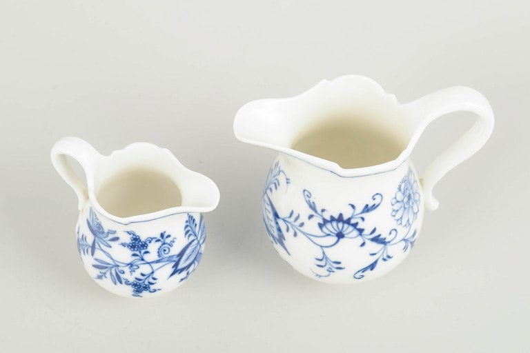 Meissen, Germany. Two porcelain creamers decorated with cobalt blue glaze, “Blue Onion??. Circa - 2