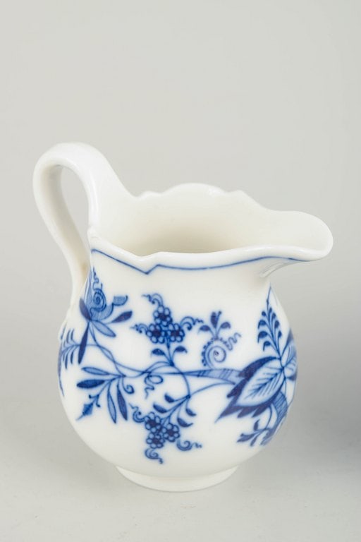Meissen, Germany. Two porcelain creamers decorated with cobalt blue glaze, “Blue Onion??. Circa - 3
