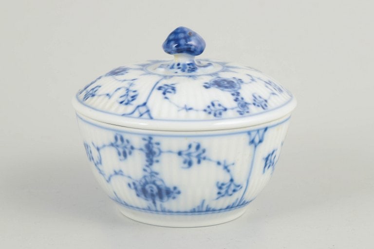 Royal Copenhagen, Denmark. Porcelain sugar bowl decorated with cobalt-blue underglaze , Blue Fluted: Royal Copenhagen, sugar bowl, Blue Fluted Plain. Fluted sugar bowl in glazed porcelain with hand-painted cobalt-blue underglaze decoration. Classic rounded form with matching lid topped by a finial. M