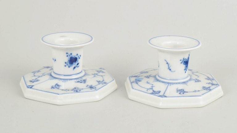 Royal Copenhagen, Denmark. Pair of porcelain candlesticks decorated cobalt-blue underglaze, Blue: Royal Copenhagen, pair of candlesticks, Blue Fluted Plain. 1980s. Pair of fluted candlesticks in glazed porcelain with hand-painted cobalt-blue underglaze decoration. Octagonal bases with a low, well-
