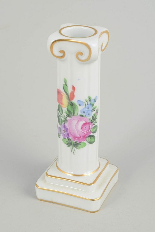 Herend, Hungary. Porcelain candlestick with floral decoration. Mid-20th century.: Herend, candlestick. Hand-painted candlestick in glazed porcelain with floral decoration in pink, purple, blue and green tones. Slender baluster-shaped column on a square base with moulded details