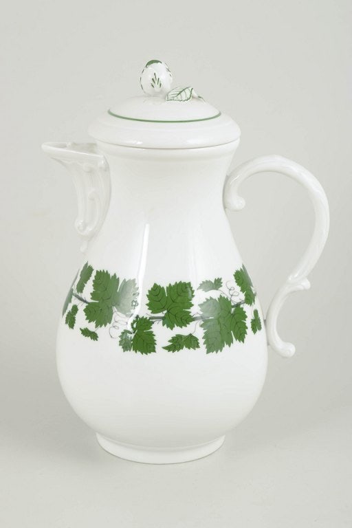 Meissen, Germany. Porcelain coffee pot from the green vine leaf series. Early 20th century.: Meissen, coffee pot from the green vine leaf series. Porcelain coffee pot with a green vine and vine-leaf decoration around the body; from the green vine leaf series. Marked with the Meissen crossed