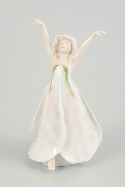 Bing & Grøndahl, Denmark. Little Ida's Flowers porcelain figurine of a young girl. Approx. 1970s.: Bing & Grøndahl, Little Ida's Flowers figurine. Porcelain figurine depicting Little Ida's Flowers, produced for the H.C. Andersen Collection. The figure shows a young girl with raised arms and a flow