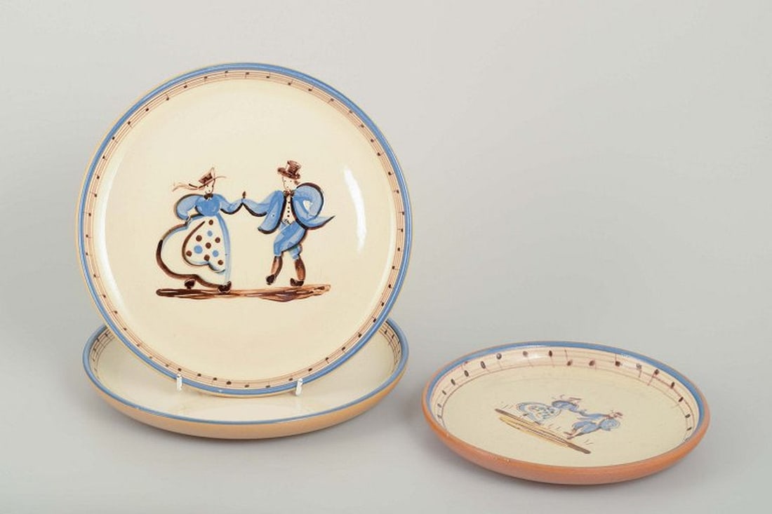 Danish studio pottery. Three thrown faience plates hand-decorated with dancing motifs. Ca. 1940/50s. (1 of 5)