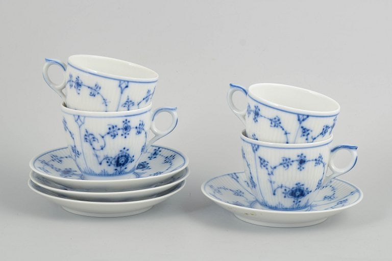 Royal Copenhagen, Denmark. Blue Fluted Plain, set of four porcelain coffee cups with saucers.: Royal Copenhagen, Blue Fluted Plain, coffee set for 4 persons. Porcelain coffee set from the Blue Fluted Plain series, consisting of cups and saucers for four persons, model 1/2162. Classic fluted for