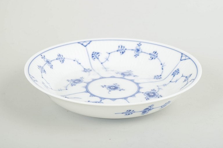 Royal Copenhagen, Denmark. Blue Fluted Plain porcelain bowl decorated with cobalt blue underglaze.: Royal Copenhagen, Blue Fluted Plain bowl. Deep bowl decorated with hand-painted cobalt blue underglaze in the classic Blue Fluted Plain pattern. Model 1/291. The gently sloping form with a segmented