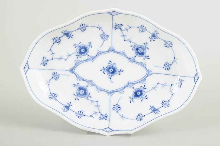 Royal Copenhagen, Denmark. Blue Fluted Plain porcelain dish decorated with cobalt blue underglaze.: Royal Copenhagen, Blue Fluted Plain dish. Oval porcelain dish decorated with hand-painted cobalt blue underglaze in the classic Blue Fluted Plain pattern. Model 1/147. The softly faceted, gently conto