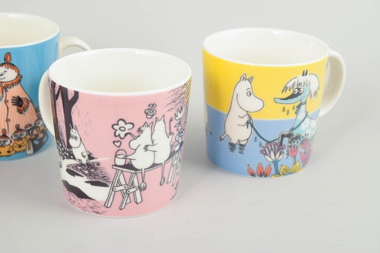 Arabia, Finland. Set of four porcelain Moomin mugs with colourful illustrations. 21st century. - 3