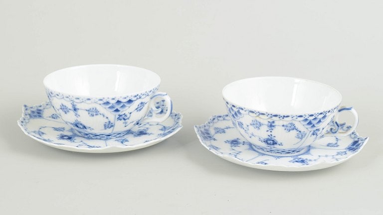 Royal Copenhagen, Denmark. Blue Fluted Full Lace set of two porcelain tea cups with saucers: Royal Copenhagen, Blue Fluted Full Lace tea cups with saucers, set of 2. Two tea cups with matching saucers in hand-painted underglaze cobalt blue decoration in the Blue Fluted Full Lace pattern, feat