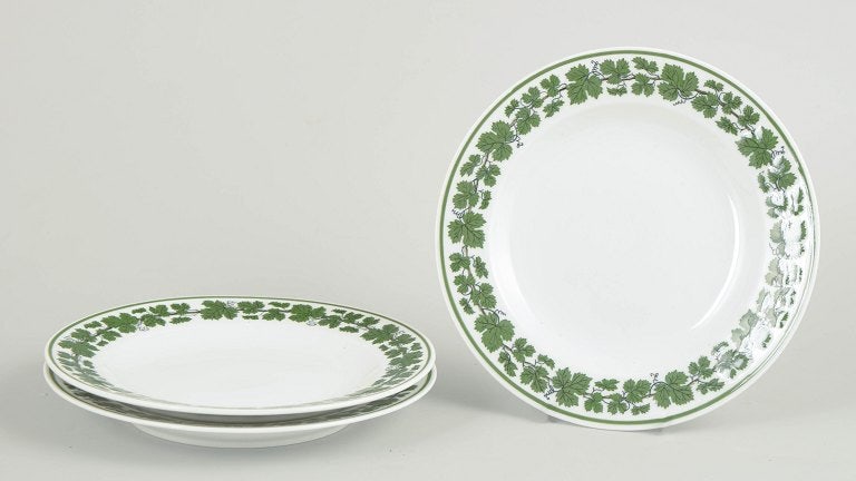 Meissen, Germany. Set of three porcelain salad plates with a green vine leaf border. Approx. 1920s.: Meissen, Vine Leaves, set of 3 salad plates. Round porcelain plates decorated with a green vine leaf border. First quality, marked with the Meissen crossed swords. Origin: Germany. Material: Porcelain