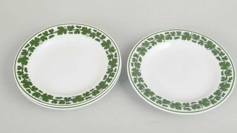 Meissen, Germany. Set of three porcelain salad plates with a green vine leaf border. Approx. 1920s. - 2