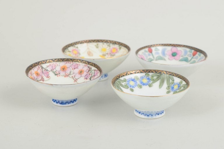 Set of four small Chinese porcelain bowls decorated in varied motifs and colours. 20th century. (1 of 4)