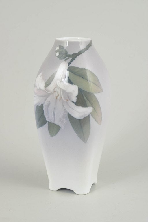 Royal Copenhagen, Denmark. Art Nouveau, porcelain vase with flowering branches and foliage. Circa: Royal Copenhagen, Art Nouveau vase. Porcelain vase with hand-painted underglaze decoration in Art Nouveau style, featuring flowering branches and foliage in soft, muted tones over a lightly shaded gro