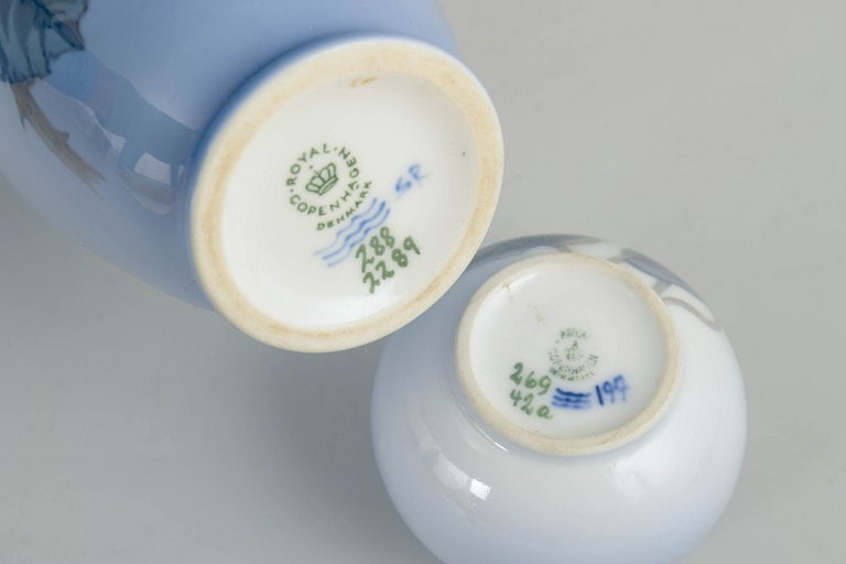 Royal Copenhagen, Denmark. Set of two porcelain vases with floral decoration in blue tone. 20th - 4