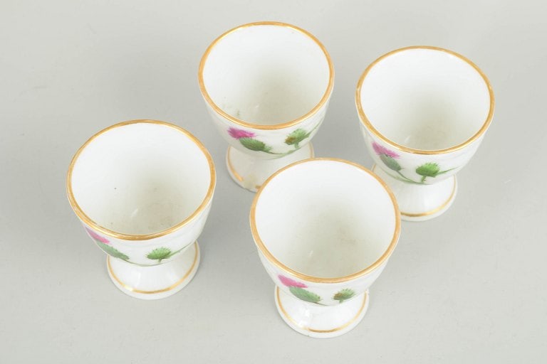 Royal Copenhagen, Denmark. Set of four porcelain egg cups with thistle motif. Second half of the - 2