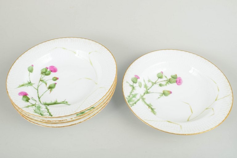 Royal Copenhagen, Denmark. Set of five large porcelain deep plates with thistle motif. Second half - 2