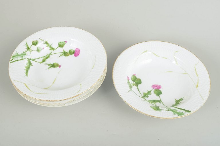 Royal Copenhagen, Denmark. Set of four porcelain deep pasta plates with thistle motif. Second half - 2