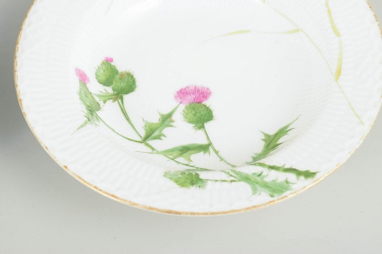 Royal Copenhagen, Denmark. Set of four porcelain deep pasta plates with thistle motif. Second half - 3