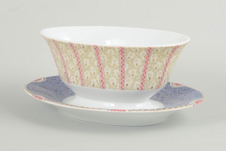 Royal Copenhagen, Denmark. Fairytale sauce boat in white porcelain with decoration in pink, blue and: Royal Copenhagen, Fairytale sauce boat. Elegant sauce boat in white porcelain decorated with the Fairytale pattern in soft pastel colours and delicate detailing. This model was produced between 1992 a