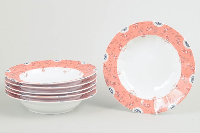 Royal Copenhagen, Denmark. Set of six deep plates in white porcelain with decoration in pink tones. (1 of 4)