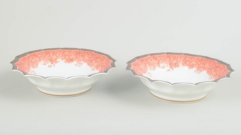 Royal Copenhagen, Denmark. Fairytale set of two porcelain bowls in pink tones. Approx. 1992–1999.: Royal Copenhagen, Fairytale set of 2 bowls. Two shallow bowls in white porcelain decorated with the Fairytale pattern in soft pink tones along the scalloped rim. First factory quality. Model 351. Orig