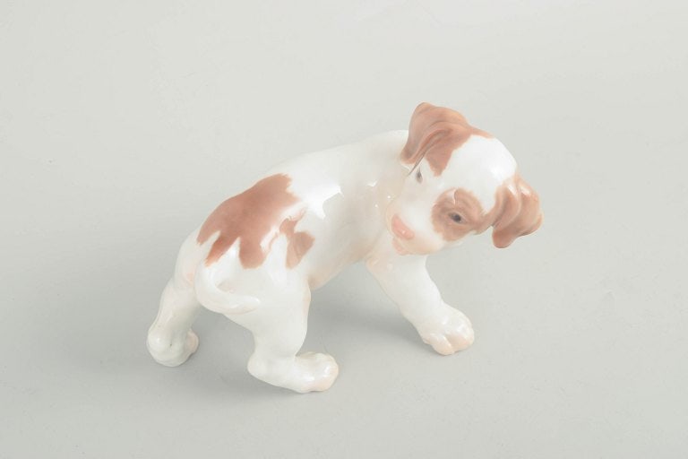 Bing & Grøndahl, Denmark. Porcelain puppy figurine in light brown and cream tones. Approx. 1920s. - 2
