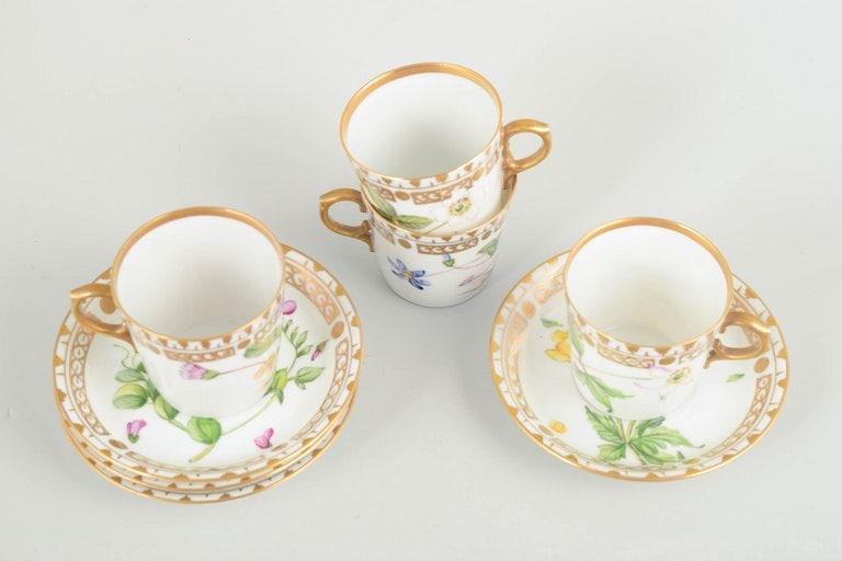 Royal Copenhagen, Denmark. Flora Danica set of four porcelain cups with matching saucers. Circa - 2