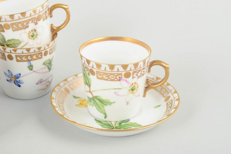 Royal Copenhagen, Denmark. Flora Danica set of four porcelain cups with matching saucers. Circa - 3