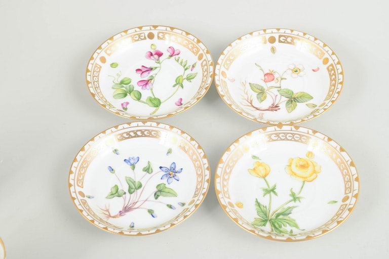 Royal Copenhagen, Denmark. Flora Danica set of four porcelain cups with matching saucers. Circa - 4