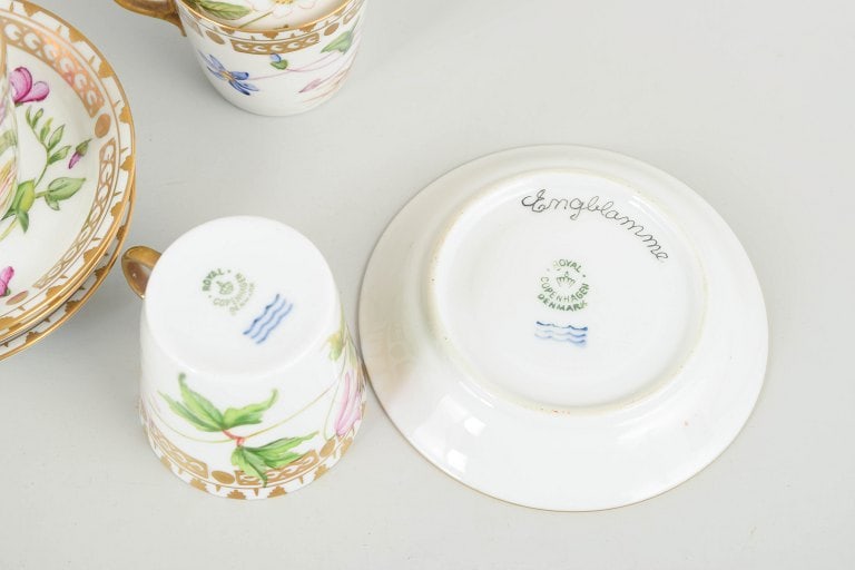 Royal Copenhagen, Denmark. Flora Danica set of four porcelain cups with matching saucers. Circa - 5