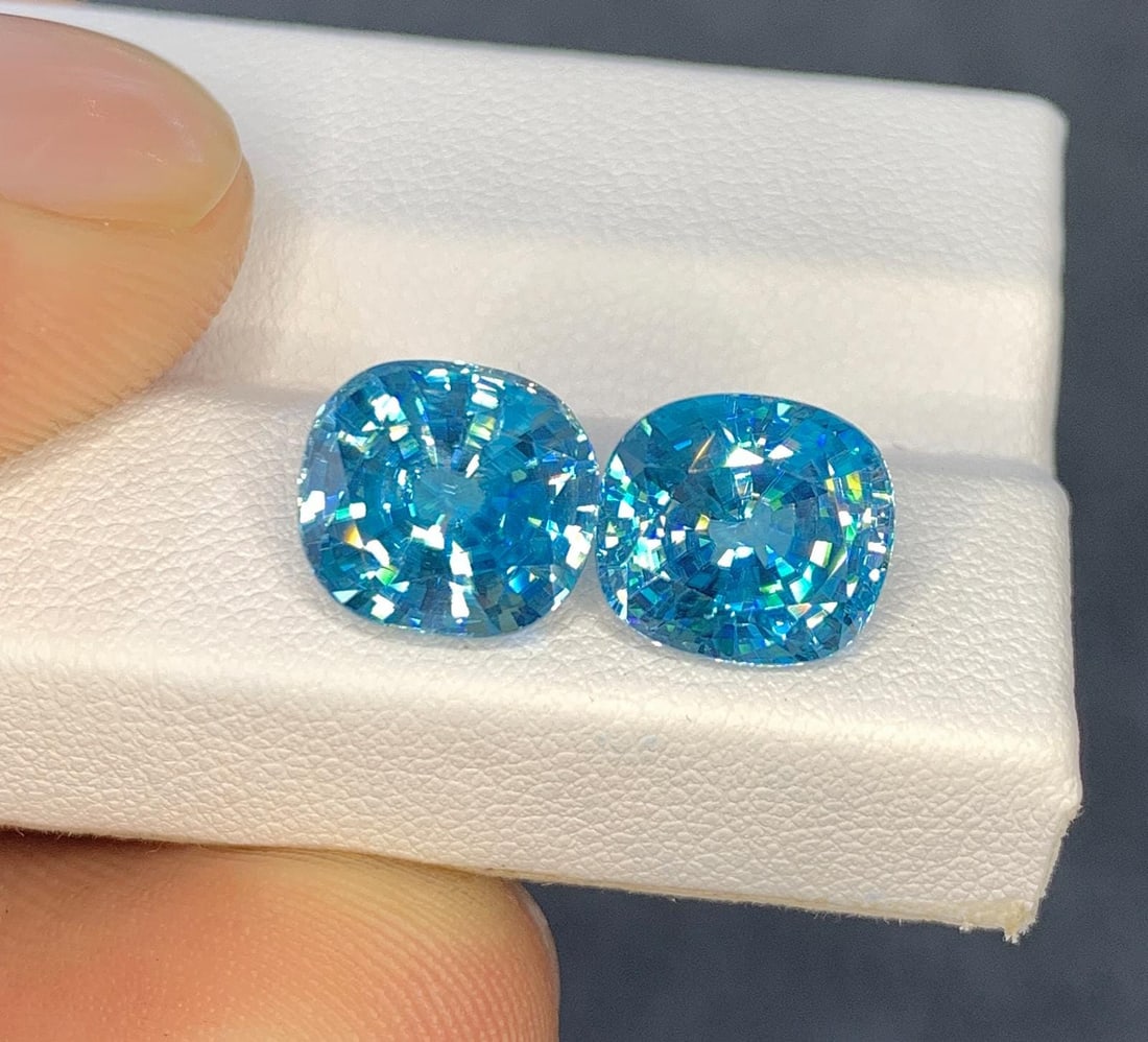 Cambodian Blue Zircon Pair Gemstone : Cushion Cut: Highlights Supplies for making crafts Materials: Gemstone: Zircon Cambodian Blue Zircon Pair Gemstone Elevate your jewelry collection with the exquisite beauty of this Natural Full Fire & Sparkly Camb