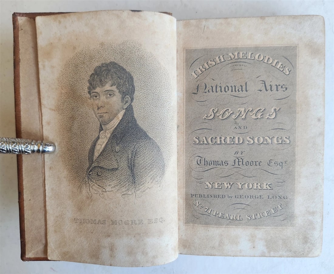 1820s IRISH MELODIES NATIONAL AIRS SONGS POEMS by THOMAS MOORE antique AMERICANA: IRISH MELODIES NATIONAL AIRS SONGS and SACRED SONGS by THOMAS MOORE Esq. New York; n.d. (c. 1820s) Size 3 3/4 by 5 3/4 inches 277 pp. Original leather binding , some wear, foxing Text in English Pleas