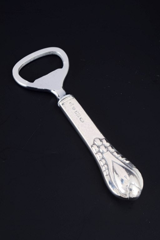Evald Nielsen, Denmark. Art nouveau bottle opener in 830 silver and stainless steel. Approx. 1920s.: Title:Evald Nielsen, Denmark. Art nouveau bottle opener in 830 silver and stainless steel. Approx. 1920s. Description:Evald Nielsen bottle opener. Model number 3 Art nouveau bottle opener in 830 silve