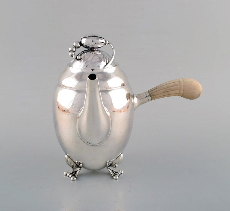 Early Georg Jensen Magnolia coffee pot in sterling silver with handle in ivory. Model number 2D. - 2