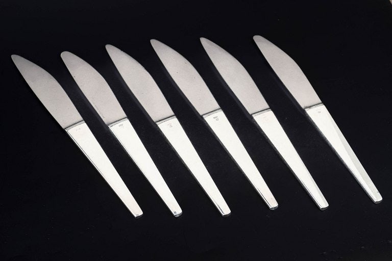 Henning Koppel for Georg Jensen, Denmark. Set of six dinner knives in stainless steel and sterling (1 of 5)