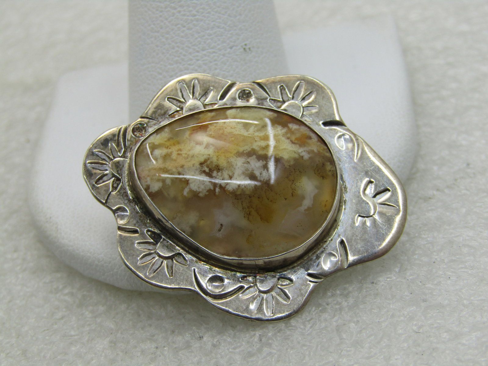 Vintage Southwestern Sterling Agate Pendant, Yellow/Tan: Vintage Southwestern Sterling Agate Pendant, Yellow/Tan, 1.5" tall and 1.25" wide, stamped frame, bezel-set appx 24mm by 10mm yellow/tan agate with a somewhat dendric look. Irregular scalloped edges w