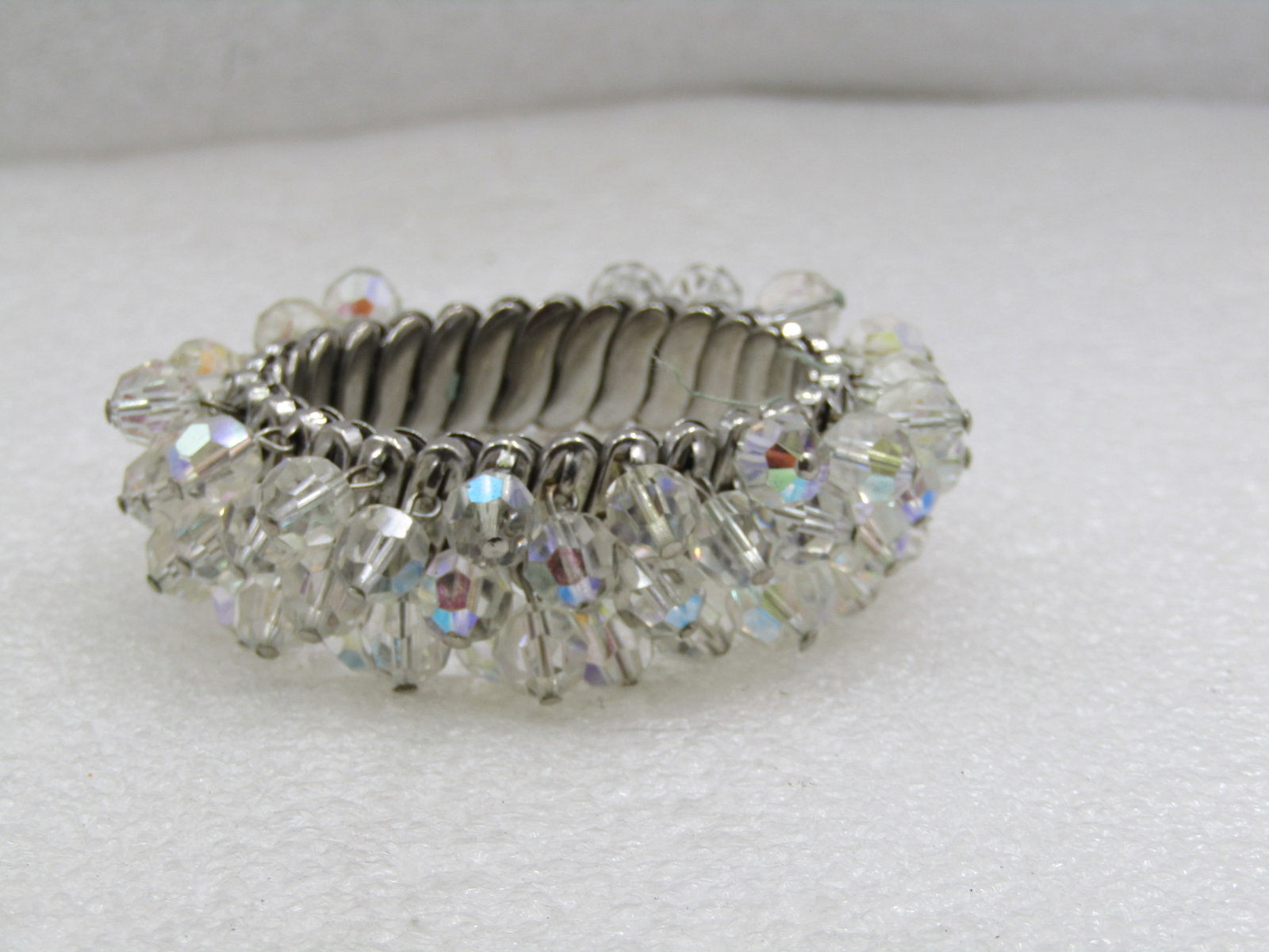 Vintage Crystal Beaded Dangle Expanding Bracelet, Mid-Century: Vintage Crystal Beaded Dangle Expanding Bracelet, Mid-Century, Expanding from 5.5" to 8". Silver tone with 7mm crystal faceted beaded dangles with an aurora borealis treatment. The bracelet is covered