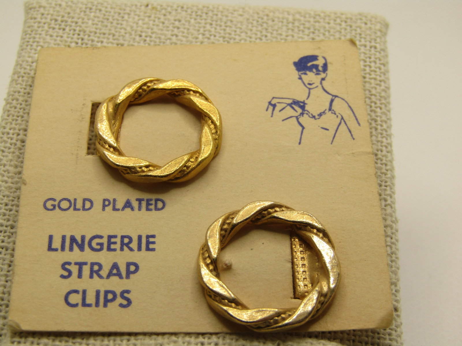 Vintage Lingerie Strap Clips, Two Circle Clips, Gold Plated, On Original Cards, Mid-Century: Vintage Lingerie Strap Clips, Two Circle Clips, Gold Plated, On Original Cards, Mid-Century. each clip is appx. 3/4" and a twisted wreath circle clip. On it's original card. Not signed by the maker. V