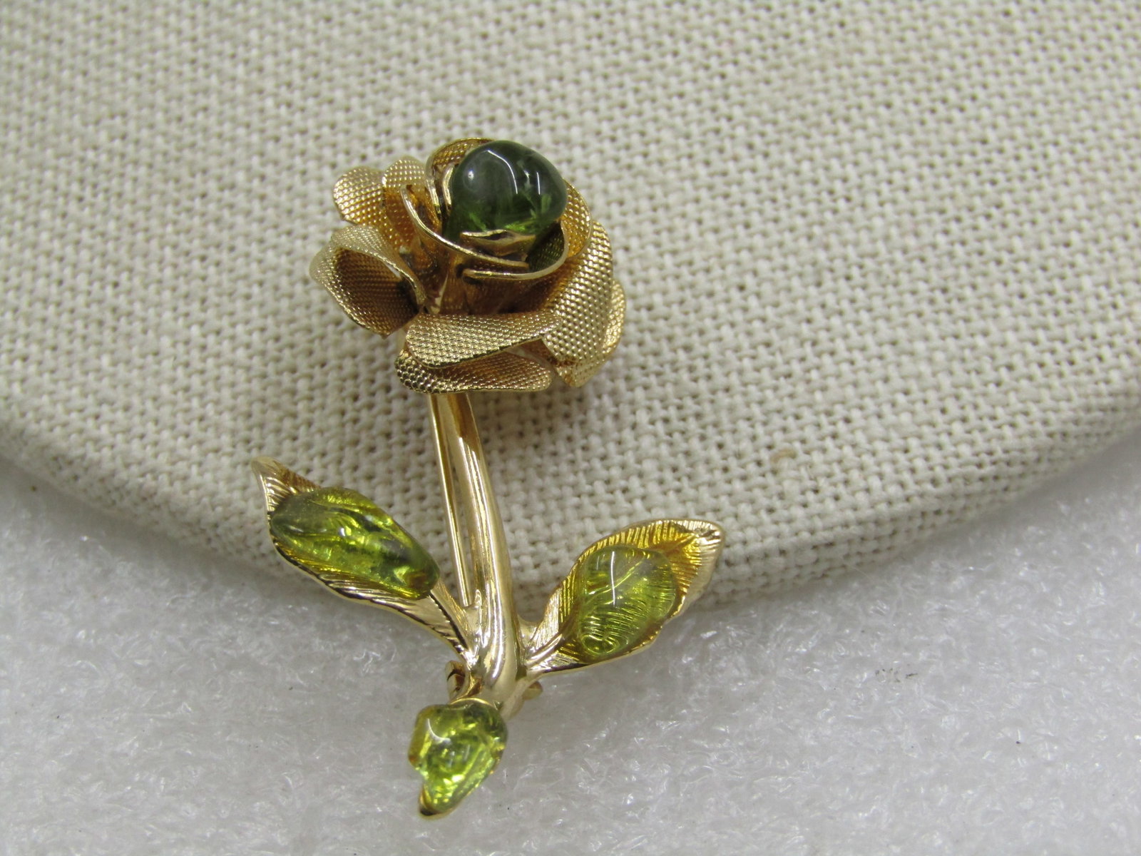 Vintage Rose Brooch, Green Stones, 1960's, 1.5": Vintage Rose Brooch, Green Stones, 1960's, 1.5" tall and 1" wide. Green stones polished nuggets - test as stone, not glass. The blossom is appx. 16.5mm wide. There is one in the center of the rose tha