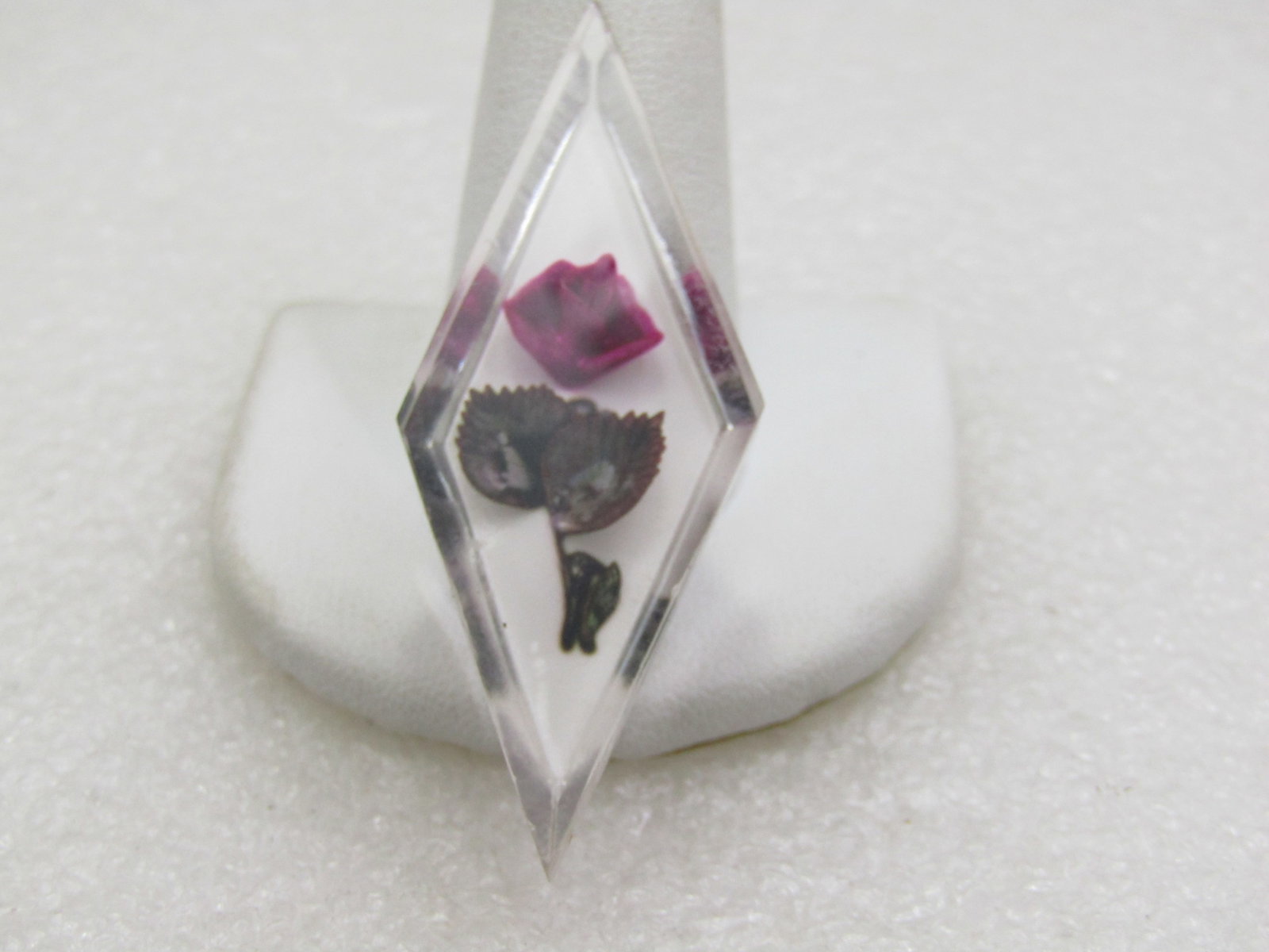 Vintage Reversed Carved Floral Brooch, Diamond Shaped, 1950's-1960's: Vintage Reversed Carved Floral Brooch, Diamond Shaped, 1950's-1960's. This is an elongaged clear diamond shape with white background and reversed carved giving it the look of an embedded red rose and