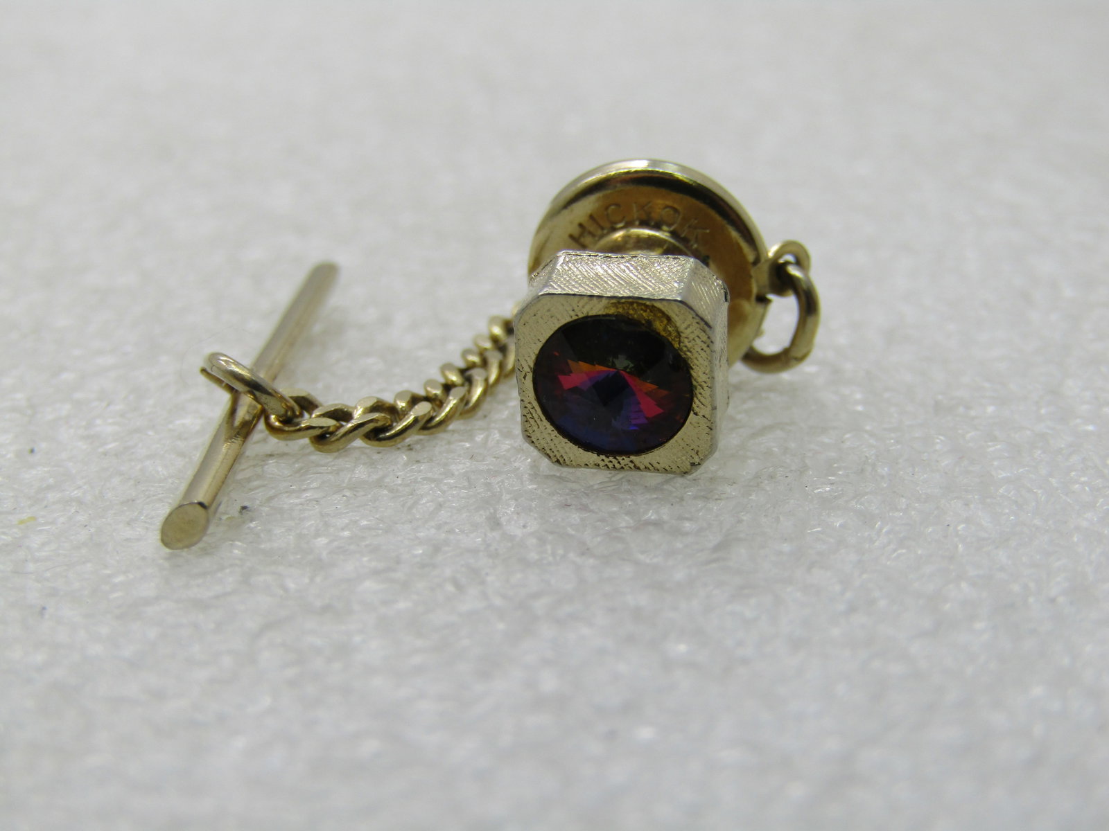 Vintage Hickok Watermelon Rivoli Tie Tack, 1960's-1970's,: Vintage Hickok Watermelon Rivoli Tie Tack, 1960's-1970's, 5mm round crystal rivoli set in a textured square setting with cut corners that is appx. 7.5mm across. This comes with the clutch and chain an