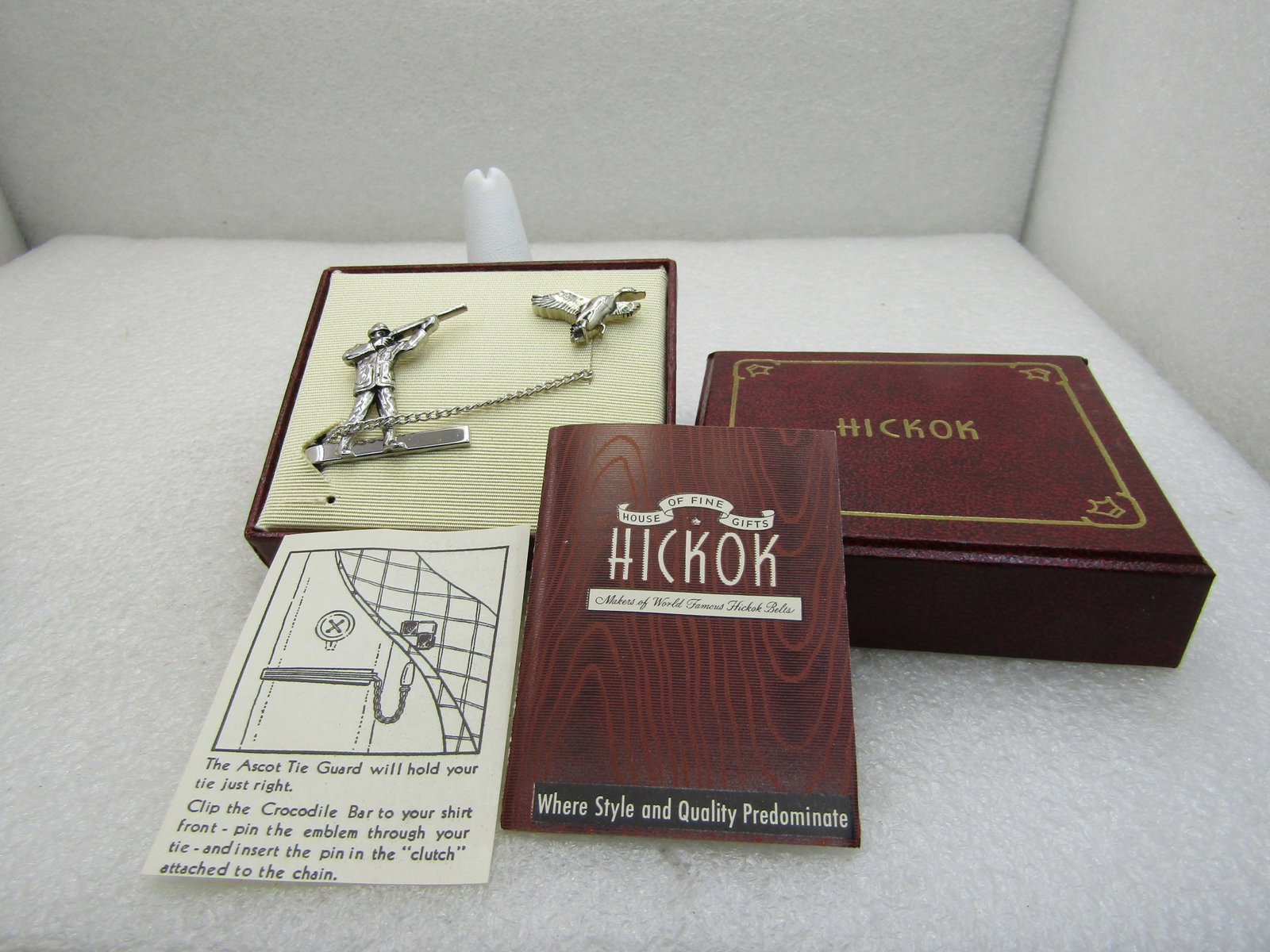 Vintage Hickok Duck Hunter and Duck Tie Clasp and Tack Pin, Original Box: Vintage Hickok Duck Hunter & Duck Tie Clasp & Tack Pin, Original Box with enclosure card. Mid-Century. New Condition. 1.25" wide and tall on the hunter with chain and 1" duck. Very good condition. (IN