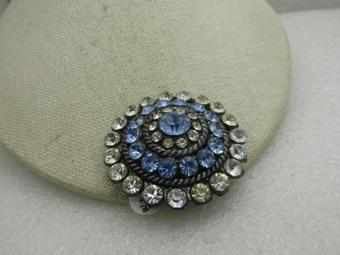 Vintage Blue and Clear Rhinestone Tiered Brooch, Mid-Century, 2",: Vintage Blue & Clear Rhinestone Tiered Brooch, Mid-Century, 2", Cast Metal. Silver tone with an outer band of 7mm clear stones, rope accent moving up the brooch to a row of 7mm blue rhinestones,